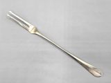 a close up of a fork and a knife on a table