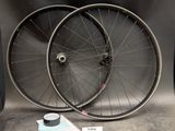 two bicycle wheels sitting next to each other on a table