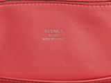a close up of a red handbag with a zipper