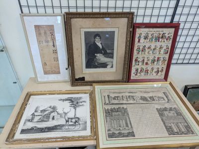 three framed pictures on a table with pictures on it