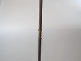 a lamp that is sitting on the floor next to a lamp