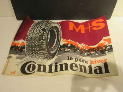 a poster with a tire on it on a table