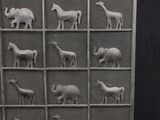 a metal screen with animals on it on a black background