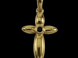 un pendentif en forme de croix en or, orné d'une pierre noire au centre