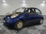 a picture of a small blue car on a checkered floor