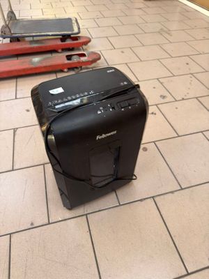 several pieces of luggage are lined up on a tiled floor