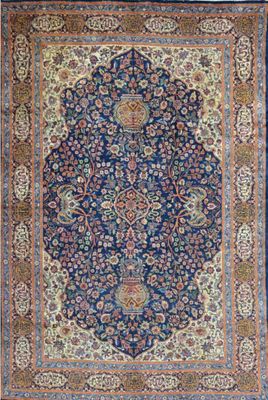 a blue rug with a medallion design on it