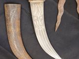 three different types of knifes are displayed on a black cloth