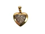 a close up of a gold heart shaped pendant with diamonds