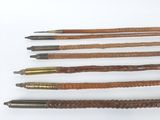 four different types of wood and metal pencils on a white surface