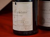 two bottles of wine that are sitting on a table