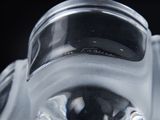 a close up view of a gas mask on a black background