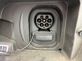 an image of a car ' s interior with an electrical plug in the center of it