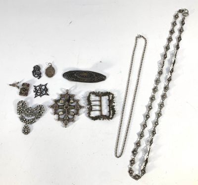 a lot of jewelry on a white surface