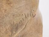 a close up of a wooden shoe with writing on it