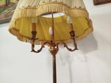 a lamp that has a yellow shade on top of it