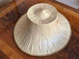 a white hat sitting on top of a wooden table