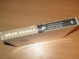 a box that is sitting on a table with a pen in it