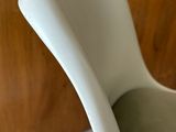 a white vase that is sitting on a table