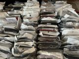 a large pile of electronic devices sitting on a table