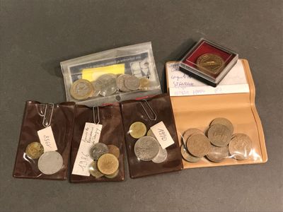 a lot of coins that are sitting in a wallet