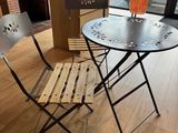 a table and chairs in a room with a fire place