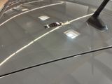 a close up of a car ' s hood with a sticker on it