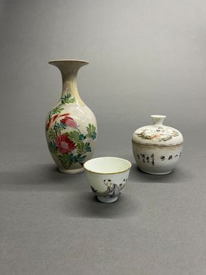 three small vases sitting next to each other on a table