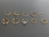 a bunch of rings sitting on top of a table next to each other