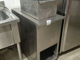 two stainless steel sinks and a refrigerator in a kitchen