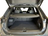 the back of a car with the trunk open and the seats folded down