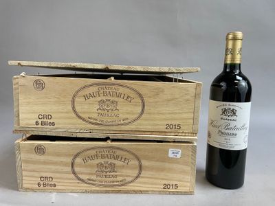 two wooden boxes with a bottle of wine next to it