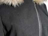 an image of a woman ' s jacket with a fur collar
