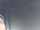 a broken windshield of a car with a broken window