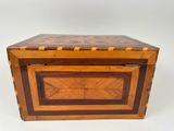a small wooden box with a wooden top and two drawers