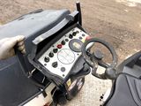 a close up of a person ' s hand holding a steering control