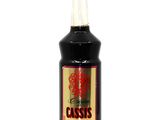 bottle of cassis syrup on a white background