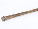 an old baseball bat on a white surface with a white background