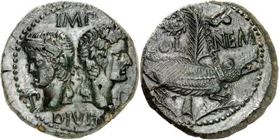 a silver coin with an image of a man and a woman on it