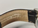 an image of a close up of a watch on a white surface
