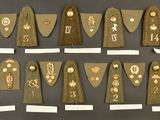 many different types of badges on display on a wall
