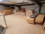 a large warehouse filled with lots of wooden planks
