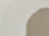 a shadow of a person on the wall of a room