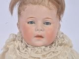 a small doll that is sitting on a table