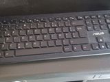 a computer keyboard sitting on top of a desk