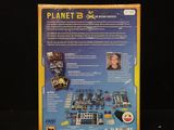 the back of a box with a game on it on a black surface