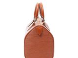 a close up of a brown louis vuitton bag on a white background