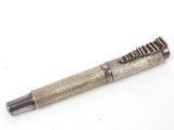 an image of a pen sitting on top of a white surface