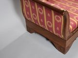 a red and gold couch with a red and gold pattern on it