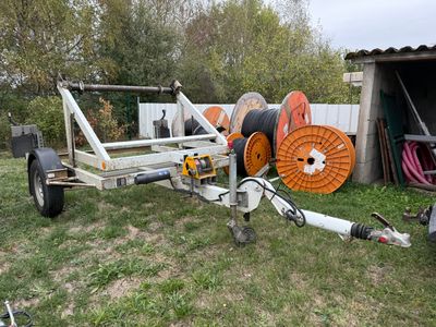 an image of a trailer with a reel attached to it